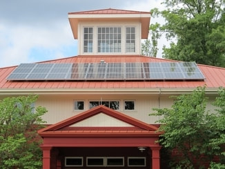 Picture of a house with 30 solar units installed on the roof. 